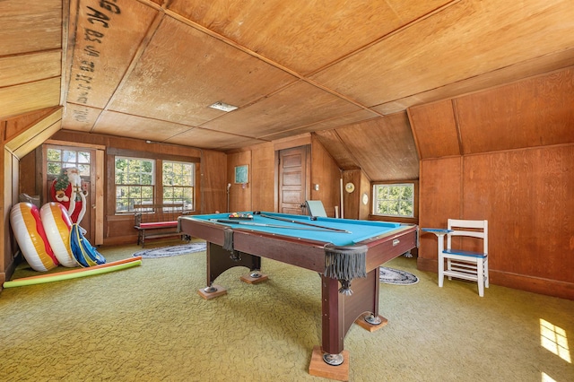 recreation room featuring vaulted ceiling, pool table, wooden walls, and carpet flooring