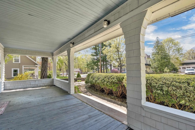 wooden terrace featuring a porch