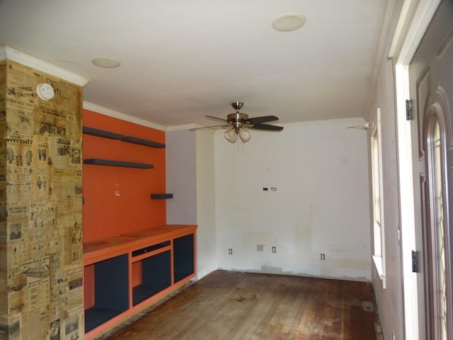 unfurnished living room featuring ceiling fan, crown molding, and wood finished floors