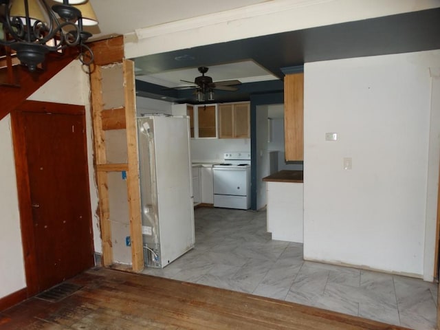 interior space with ceiling fan with notable chandelier