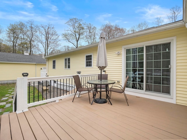 wooden deck with outdoor dining space