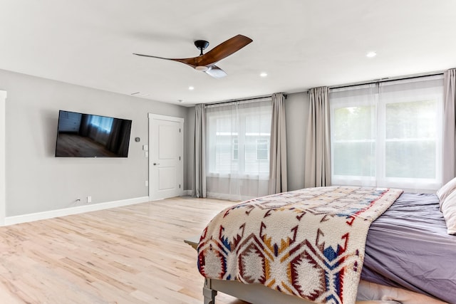 bedroom with a ceiling fan, wood finished floors, baseboards, and recessed lighting