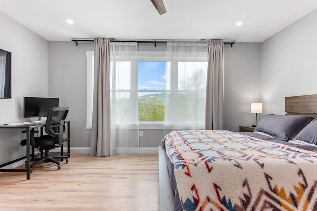 bedroom with baseboards, light wood-style flooring, recessed lighting, and a ceiling fan