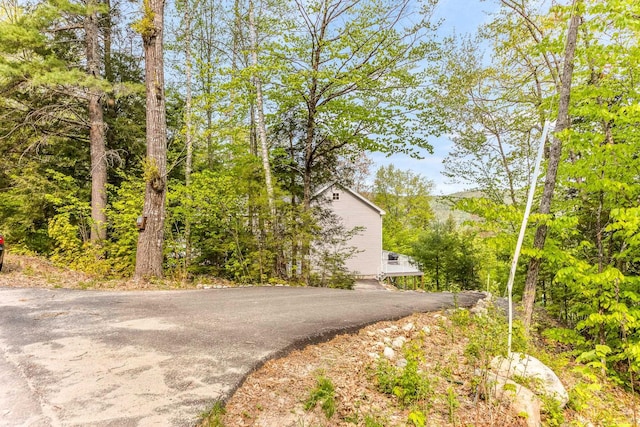 view of street featuring aphalt driveway