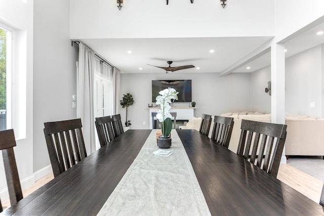 dining space with ceiling fan, wood finished floors, baseboards, and recessed lighting