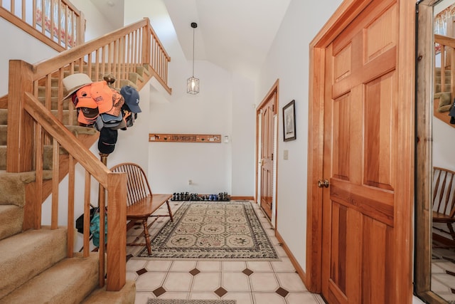 390 Bear Hill Rd, Loudon, NH 03307 - foyer with stairway, baseboards, and high vaulted ceiling