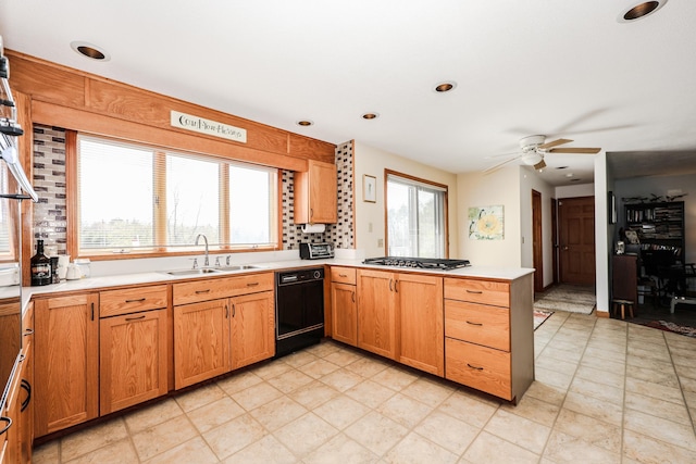 390 Bear Hill Rd, Loudon, NH 03307 - kitchen featuring a ceiling fan, black dishwasher, a sink, a peninsula, and light countertops