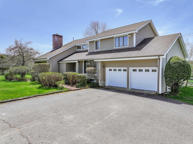 390 Bear Hill Rd, Loudon, NH 03307 - traditional home featuring a shingled roof, driveway, a chimney, and a front yard