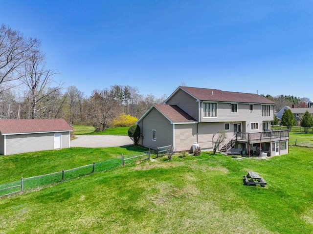 390 Bear Hill Rd, Loudon, NH 03307 - back of property with a yard, fence, a deck, and stairs