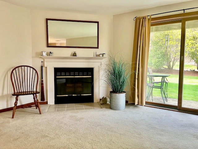 unfurnished living room with baseboards, carpet flooring, and a fireplace with flush hearth