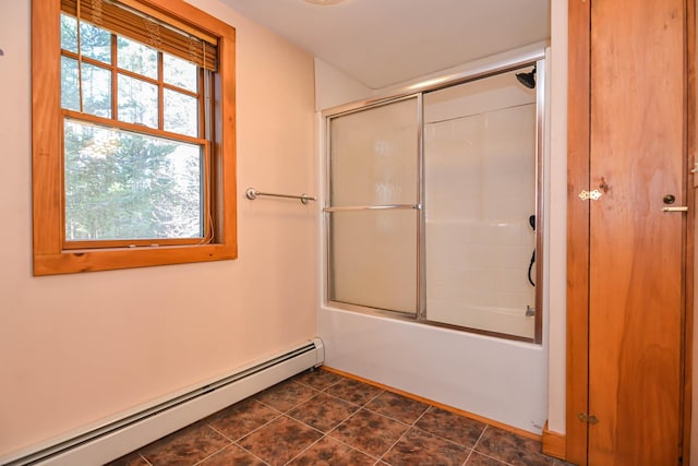 full bath with enclosed tub / shower combo, tile patterned floors, and a baseboard heating unit