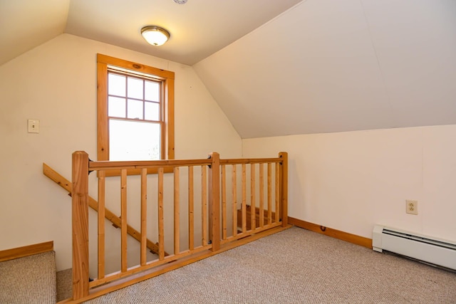 additional living space with baseboards, lofted ceiling, a baseboard radiator, and carpet floors