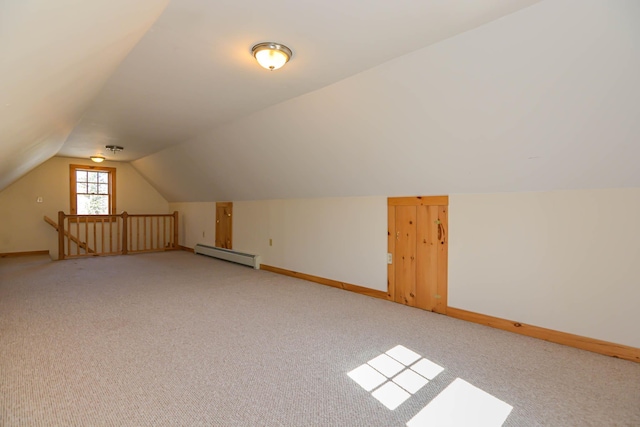 bonus room featuring lofted ceiling, light carpet, a baseboard radiator, and baseboards
