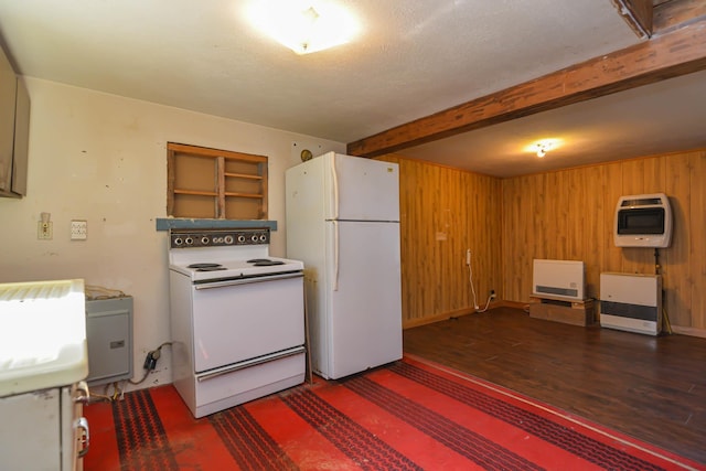 kitchen featuring heating unit, white appliances, wood walls, wood finished floors, and beam ceiling