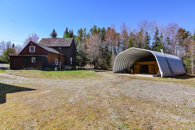 view of car parking with driveway and a carport