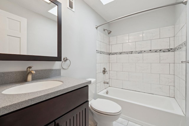 bathroom featuring toilet, bathtub / shower combination, tile patterned floors, visible vents, and vanity