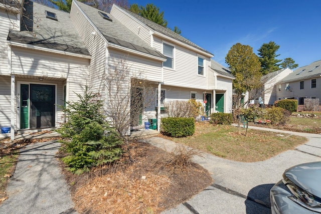 exterior space with a shingled roof