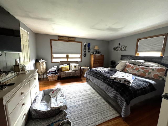 bedroom with wood finished floors