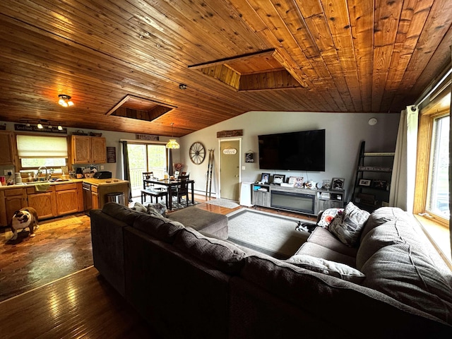 living area with lofted ceiling, a healthy amount of sunlight, and wood ceiling