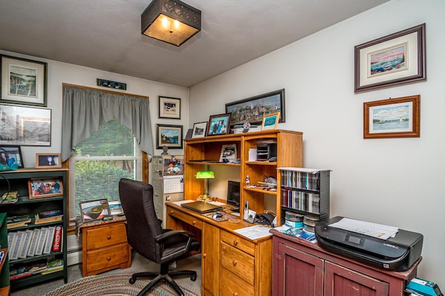 carpeted office featuring a baseboard radiator
