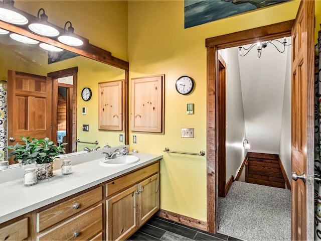 bathroom with vanity and baseboards