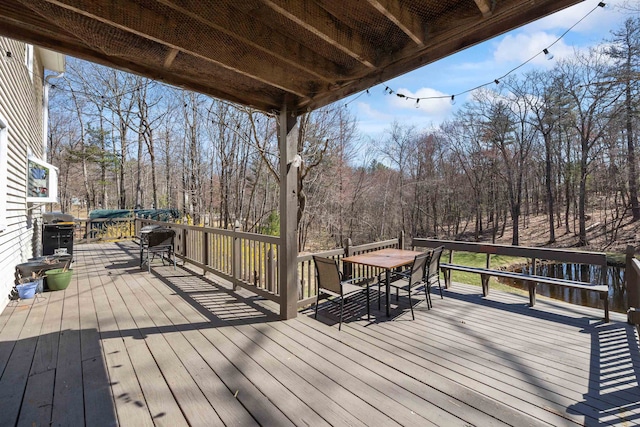 wooden deck with outdoor dining space