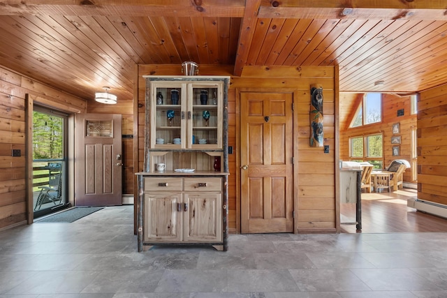 93 Roller Coaster Rd, Laconia, NH 03246 - kitchen with wooden walls, wood ceiling, glass insert cabinets, and baseboard heating