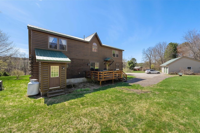 93 Roller Coaster Rd, Laconia, NH 03246 - rear view of house featuring a deck, metal roof, a yard, and log exterior