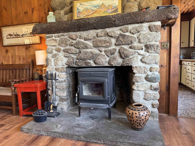 60 Effingham Rd, Ossipee, NH 03864 - detailed view of a wood stove, wood finished floors, and wooden walls