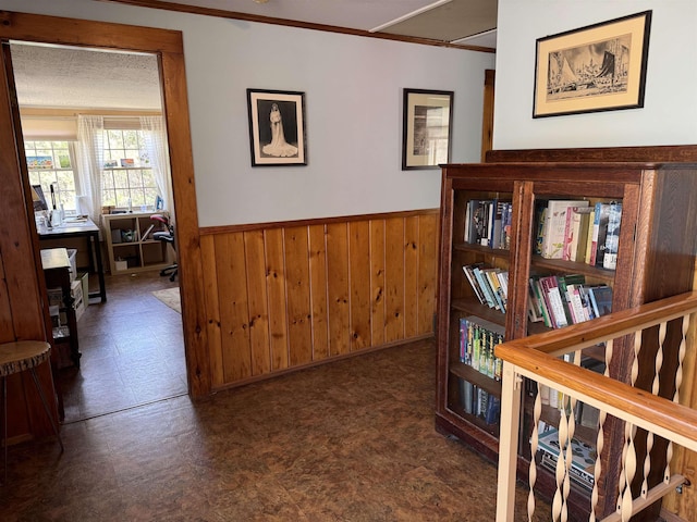 60 Effingham Rd, Ossipee, NH 03864 - hall featuring ornamental molding, tile patterned floors, wainscoting, and wood walls