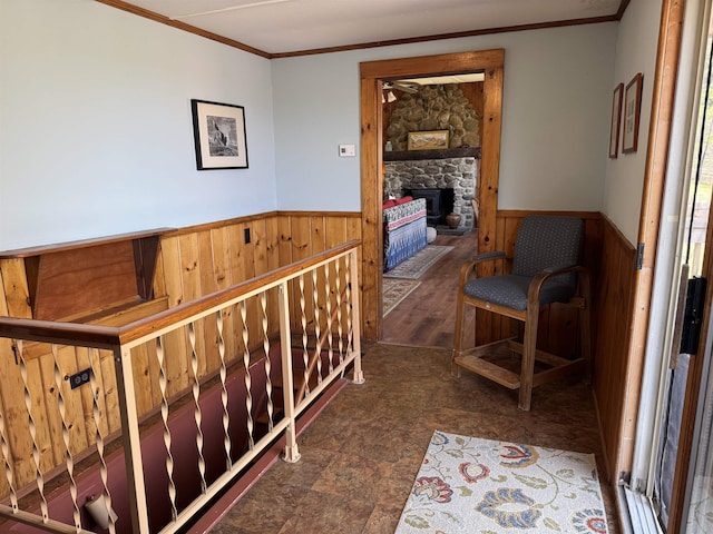 60 Effingham Rd, Ossipee, NH 03864 - corridor with a wainscoted wall, crown molding, wooden walls, and an upstairs landing