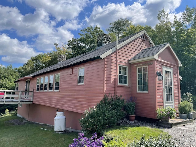 60 Effingham Rd, Ossipee, NH 03864 - view of side of home with a chimney, a lawn, and a wooden deck