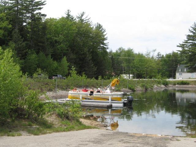 60 Effingham Rd, Ossipee, NH 03864 - surrounding community with a water view and a dock