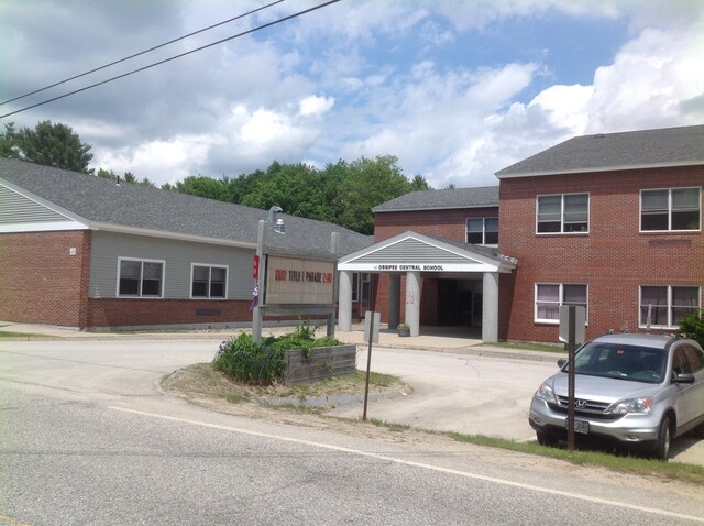 60 Effingham Rd, Ossipee, NH 03864 - view of front facade featuring brick siding