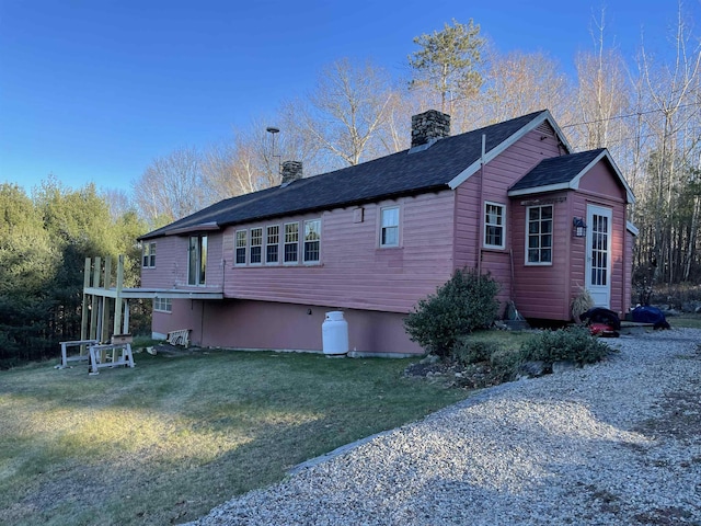 60 Effingham Rd, Ossipee, NH 03864 - back of property with a chimney, a lawn, and roof with shingles