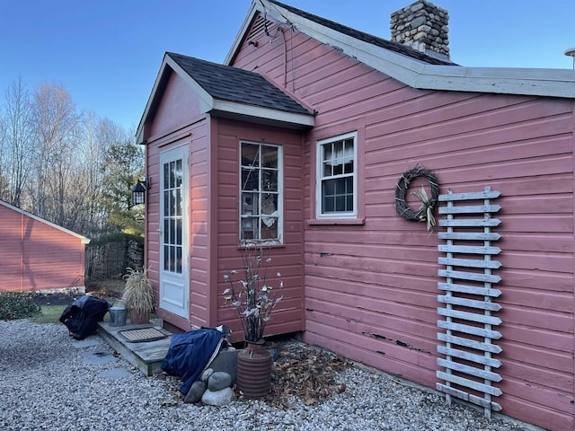 60 Effingham Rd, Ossipee, NH 03864 - view of property exterior featuring a chimney