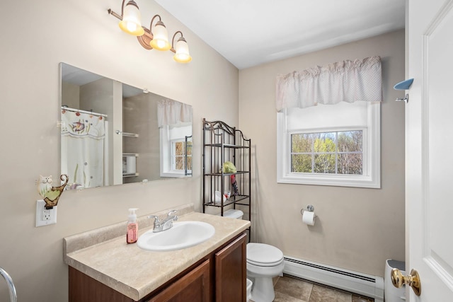 bathroom with baseboard heating, toilet, vanity, and tile patterned flooring