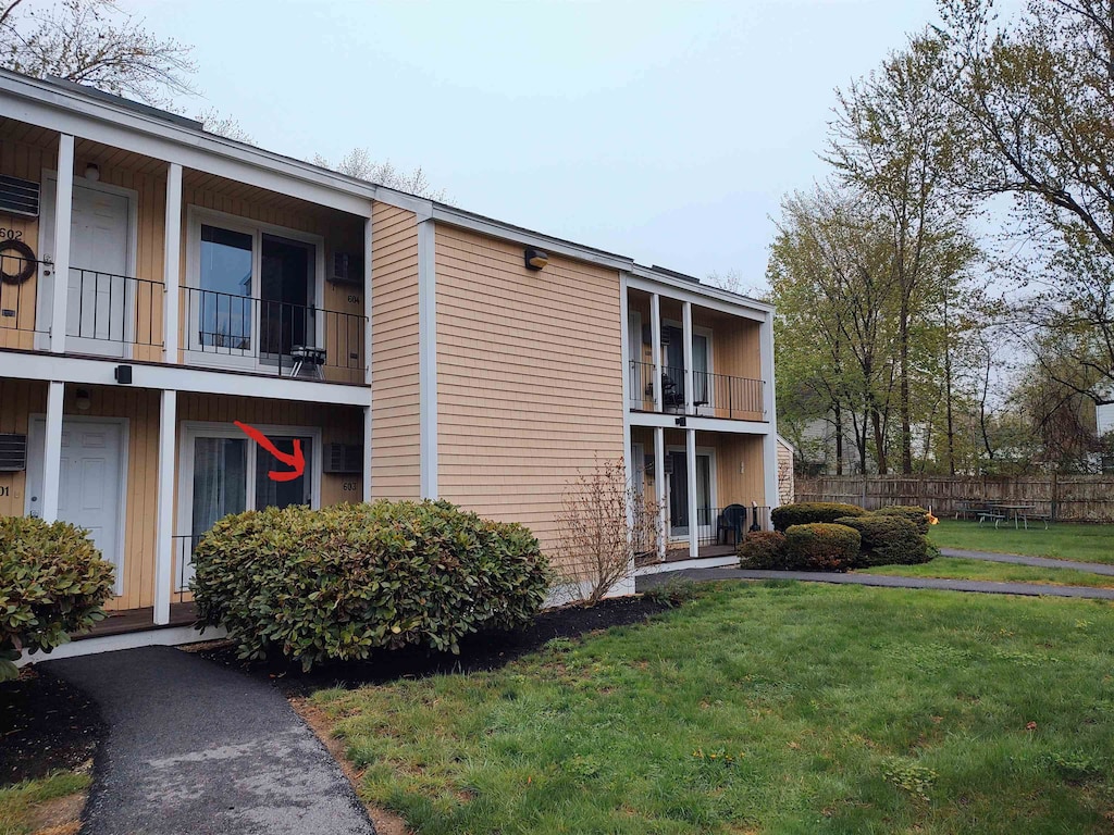 603 Cocheco Ct, Dover, NH 03820 - view of building exterior featuring fence