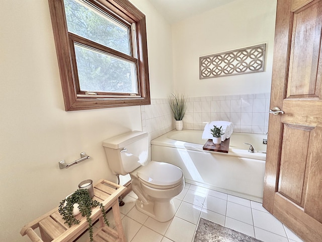 full bathroom with toilet, a garden tub, and tile patterned floors