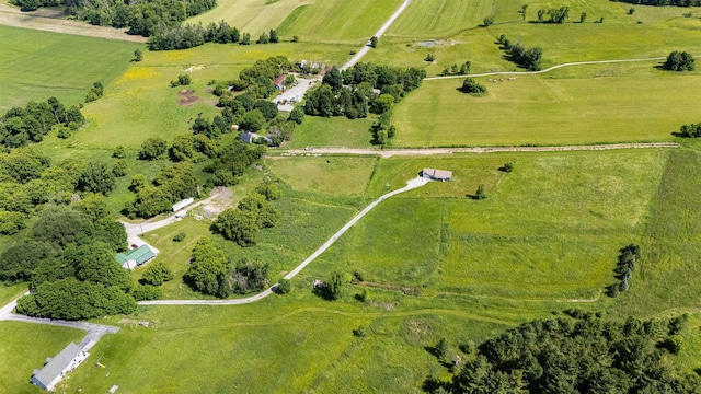 aerial view of property and surrounding area featuring rural landscape and a pastoral area