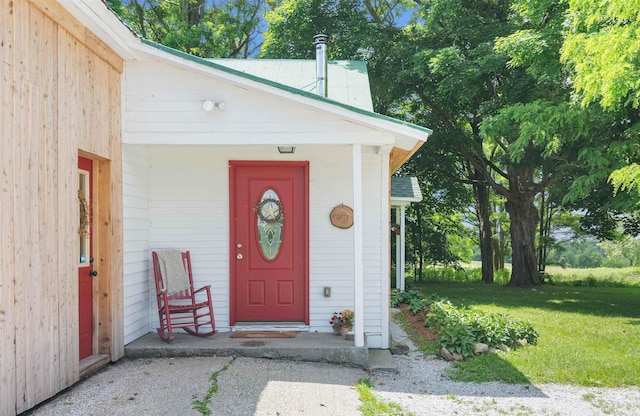 entrance to property with a yard