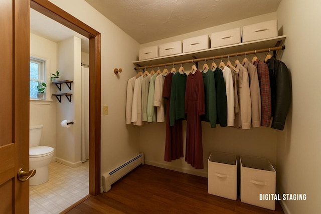 closet featuring a baseboard heating unit