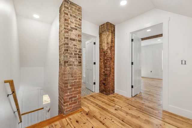 hall with light wood finished floors and recessed lighting