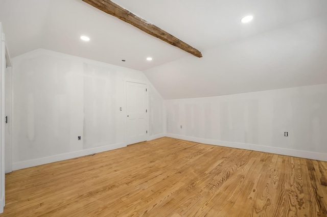 additional living space featuring light wood finished floors, baseboards, and recessed lighting