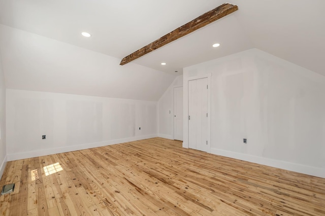 additional living space featuring lofted ceiling, light wood-type flooring, baseboards, and recessed lighting