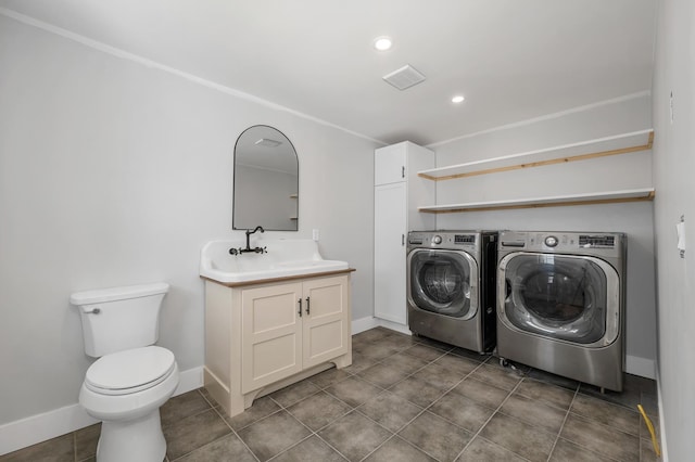 washroom featuring washer and dryer, baseboards, tile patterned flooring, and recessed lighting