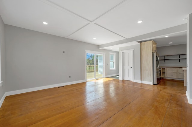 unfurnished bedroom featuring access to exterior, stainless steel fridge, baseboards, recessed lighting, and light wood-type flooring