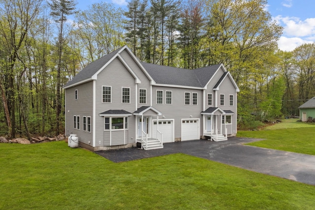 view of front of house featuring driveway, a shingled roof, an attached garage, and a front lawn