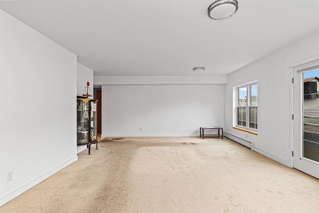 193 St Paul St Unit 101, Burlington, VT 05401 - unfurnished living room with carpet, a baseboard heating unit, and baseboards