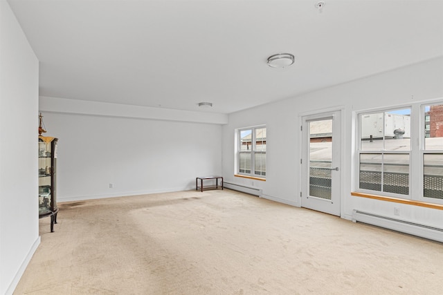 193 St Paul St Unit 101, Burlington, VT 05401 - unfurnished living room featuring carpet floors, plenty of natural light, and baseboards